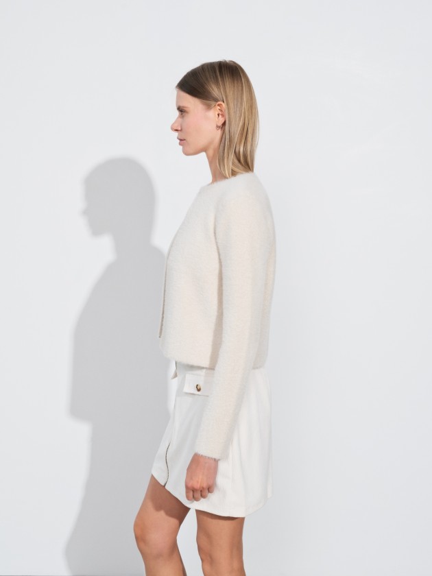 Short knitwear coat with hook closure