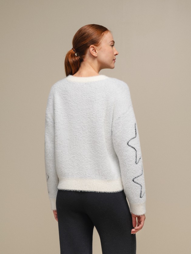 Pull en maille avec toiles