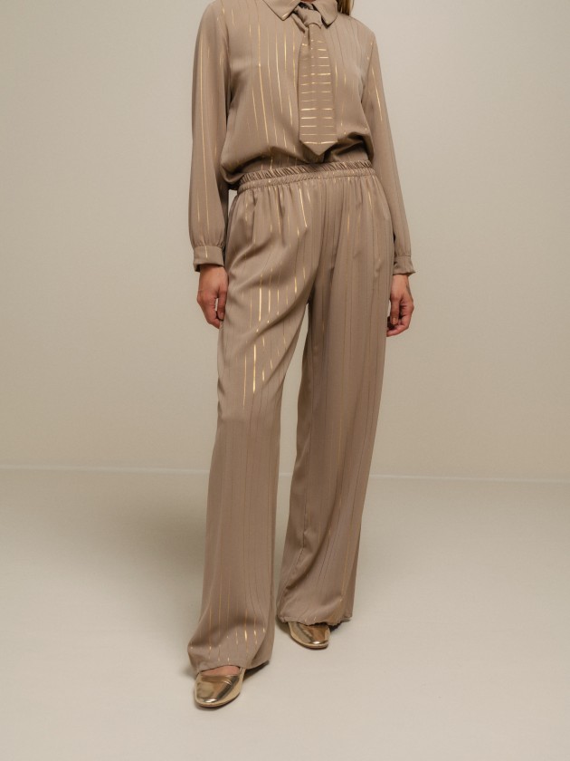 Flowy trousers with shine