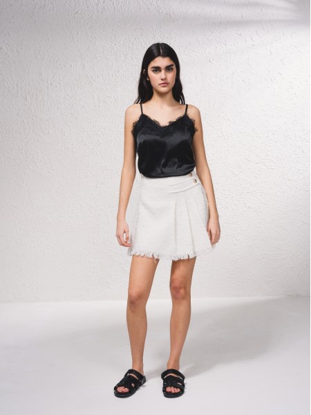 Short skirt with gold buttons