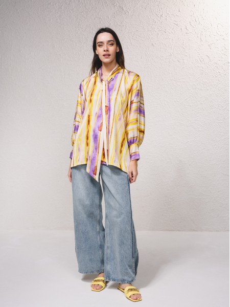 Tunic with scarf at the collar