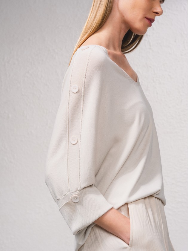 Camisola de malha com botes na manga