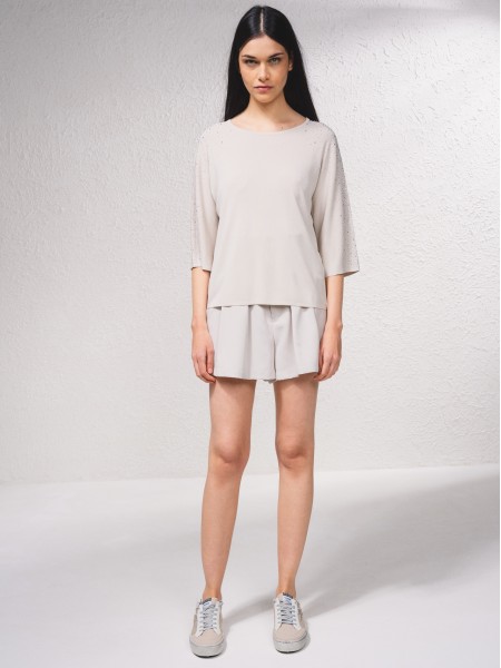Pull avec applications brillantes