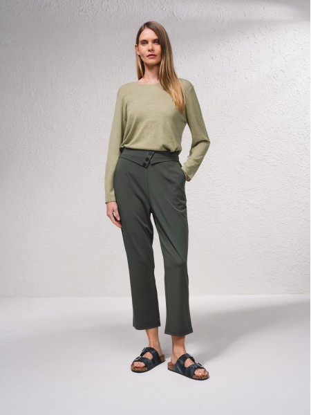 Pants with button application