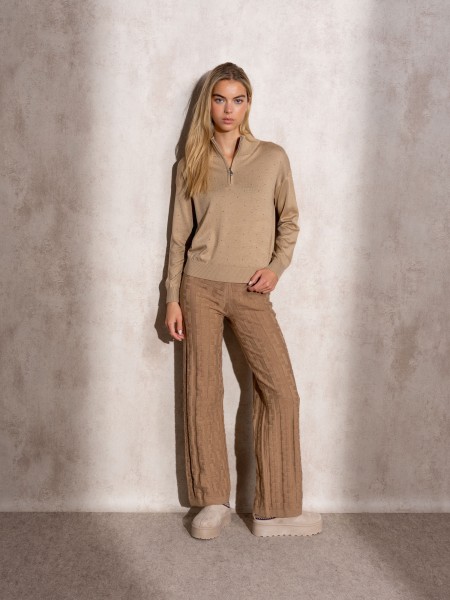 Polo tricot avec zip et applications brillantes