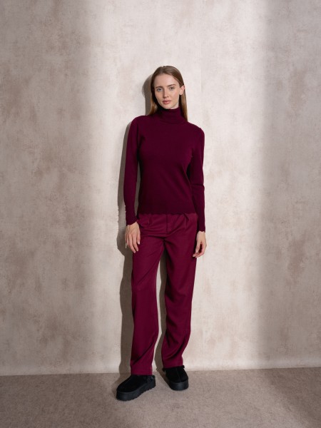 Pull en maille  col montant avec boutons dors