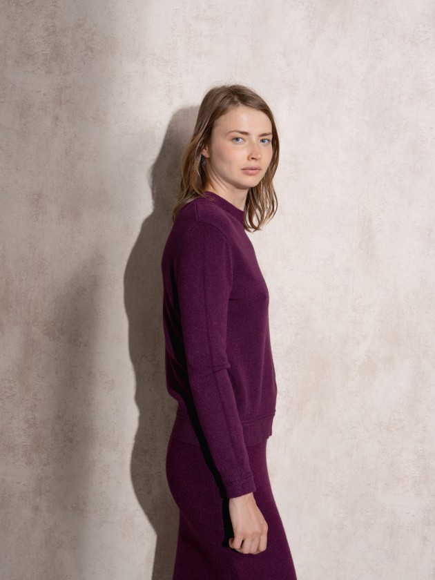 Knitted sweater with round neckline