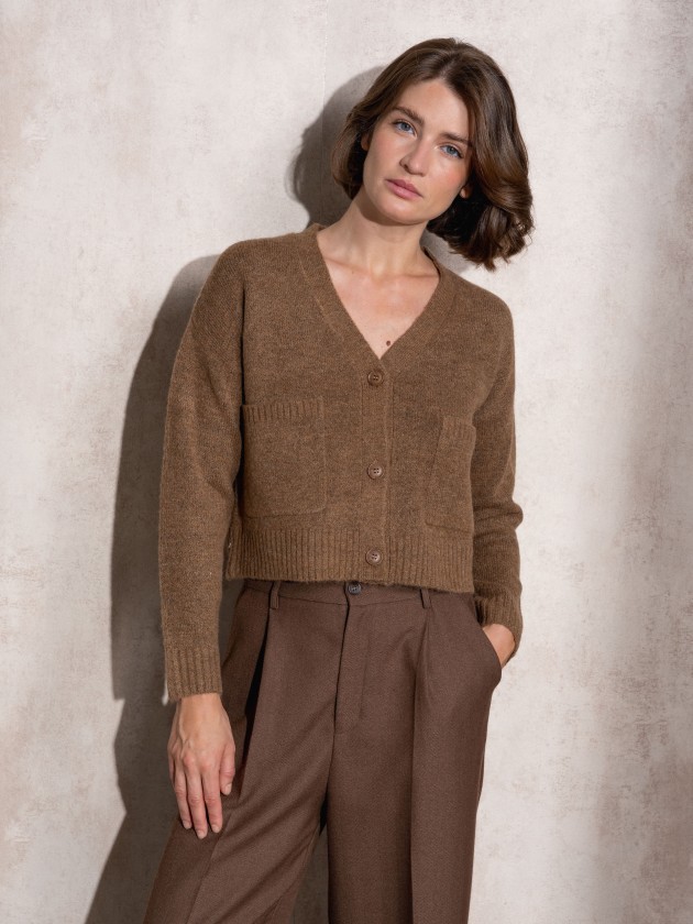 Short knitted coat with front pockets