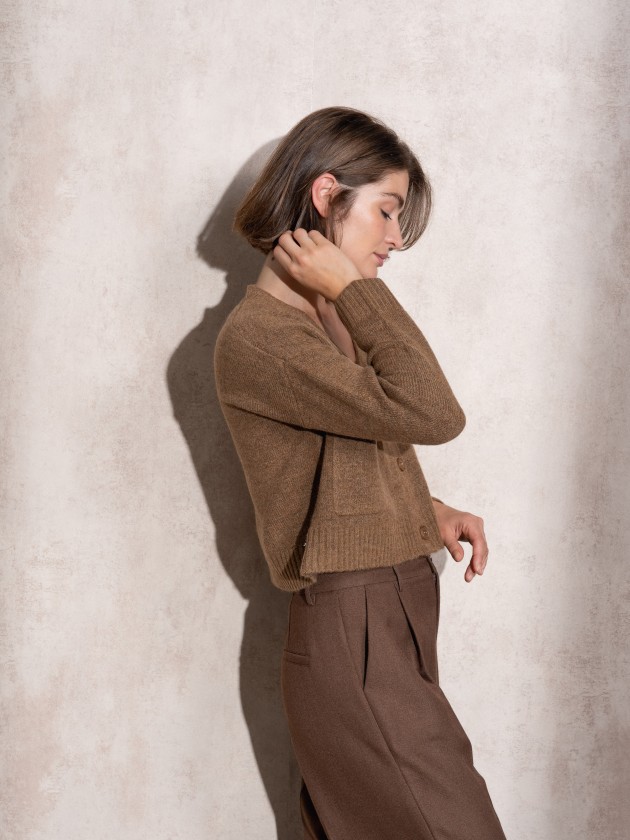 Short knitted coat with front pockets