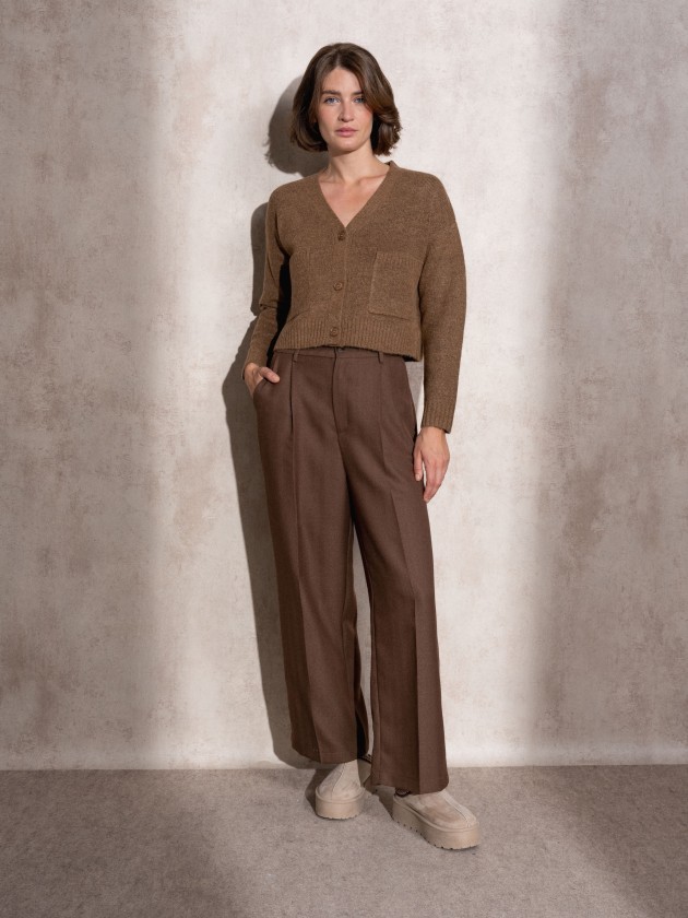 Short knitted coat with front pockets