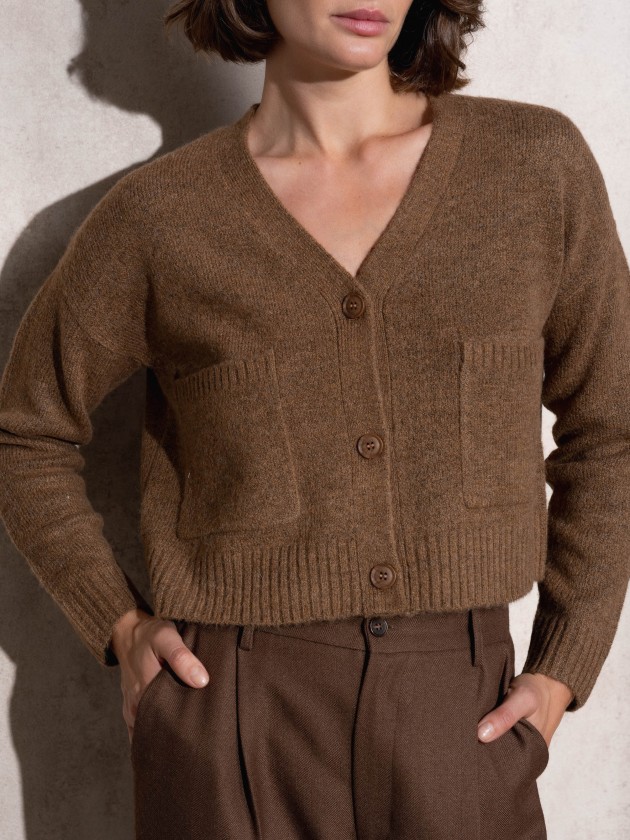 Short knitted coat with front pockets