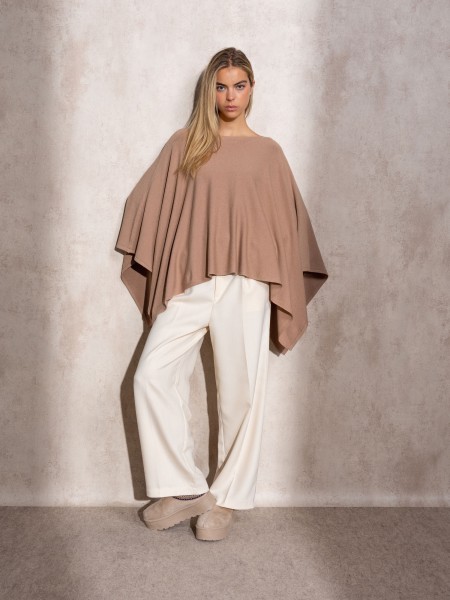 Knitted cape with round neckline
