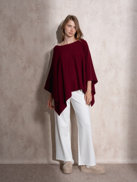 Knitted cape with round neckline