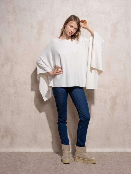 Knitted cape with round neckline