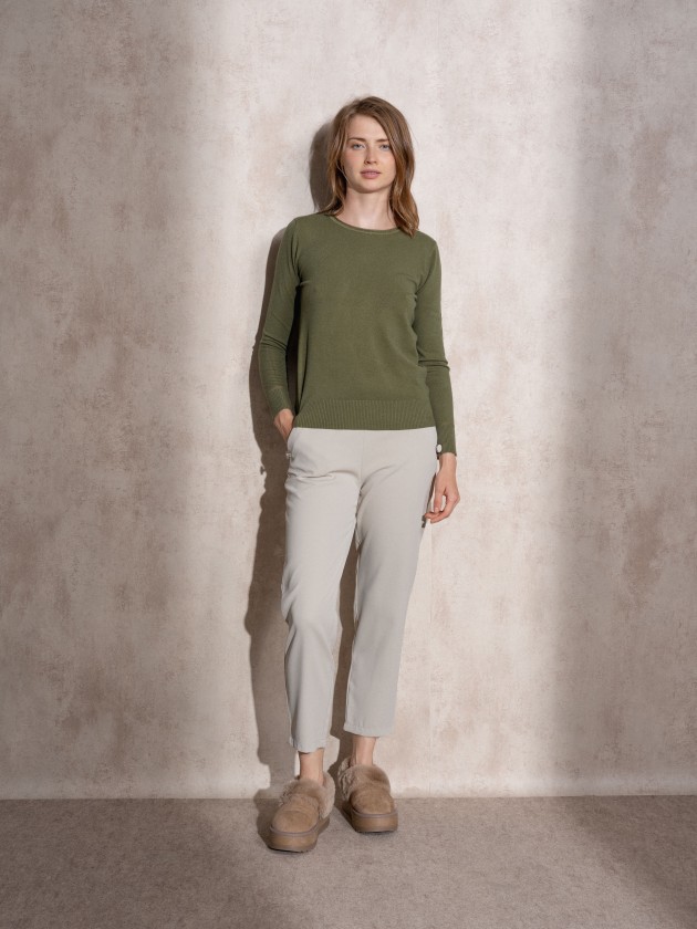 Pants with button application on pockets
