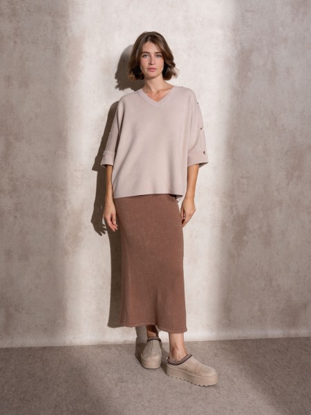 Knitted sweater with buttons on the sleeve