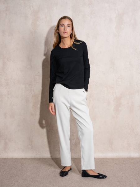 Pants with button application on pockets