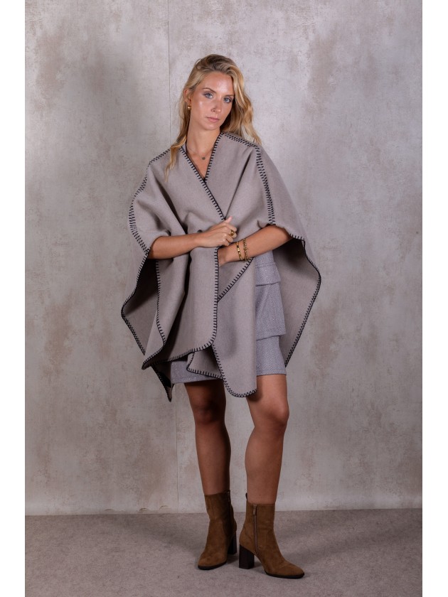 Knitted poncho with stitching detail