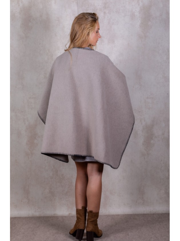 Knitted poncho with stitching detail