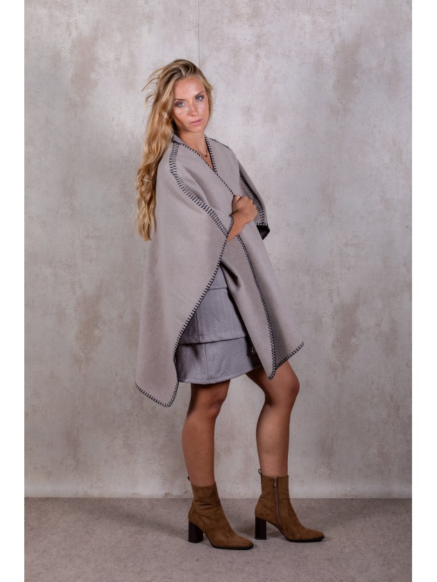 Knitted poncho with stitching detail