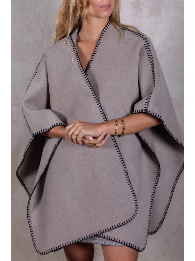 Knitted poncho with stitching detail