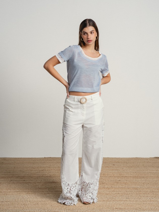 Trousers with embellishments