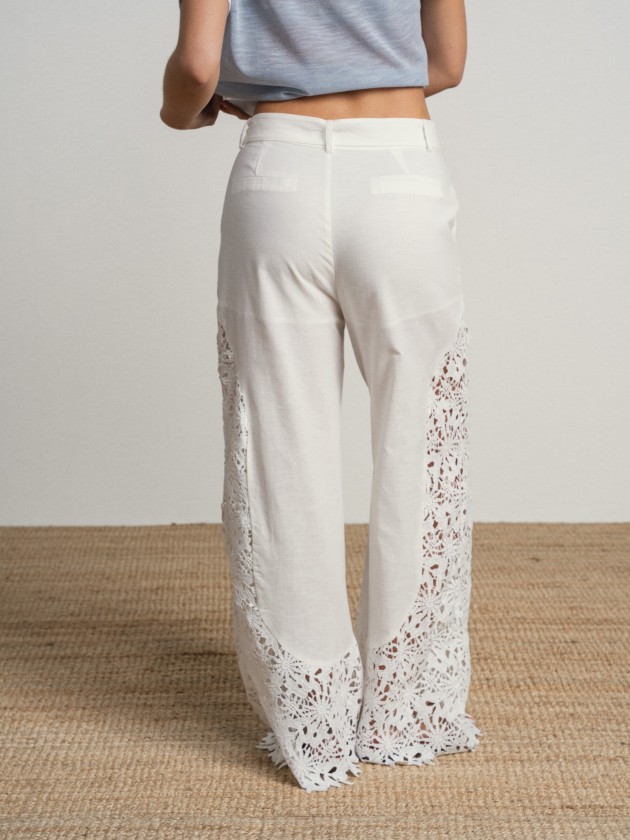 Trousers with embellishments