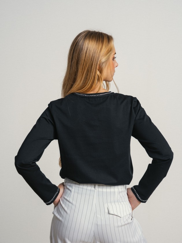 Sweater with embroidery and application