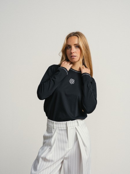 Sweater with embroidery and application
