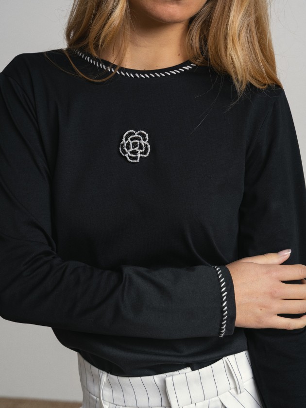 Sweater with embroidery and application