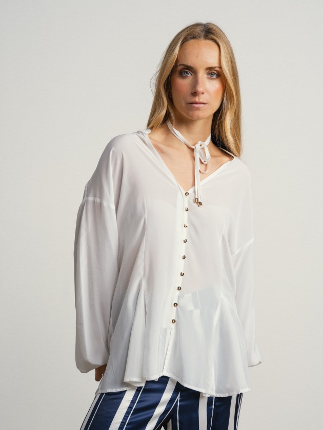 Shirt with a v-neck and drawstring waist. Shirt with a v-neck and drawstring waist.