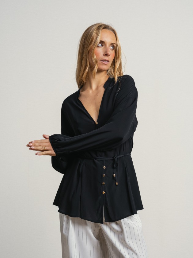Shirt with a v-neck and drawstring waist. Shirt with a v-neck and drawstring waist.