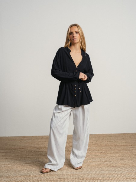 Shirt with a v-neck and drawstring waist.