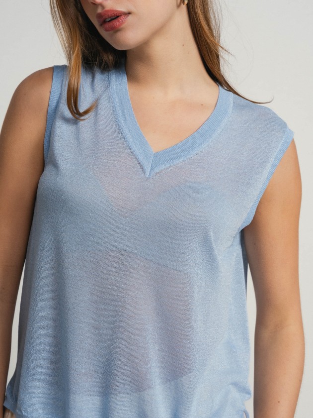 Sleeveless v-neck camisole with sheer details. Sleeveless v-neck camisole with sheer details.