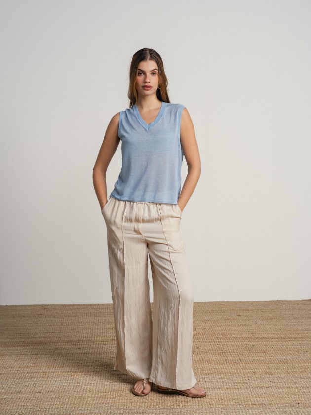 Sleeveless v-neck camisole with sheer details. Sleeveless v-neck camisole with sheer details.