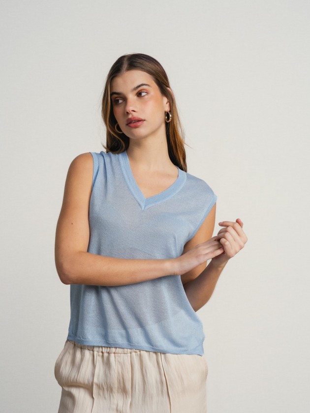Sleeveless v-neck camisole with sheer details. Sleeveless v-neck camisole with sheer details.