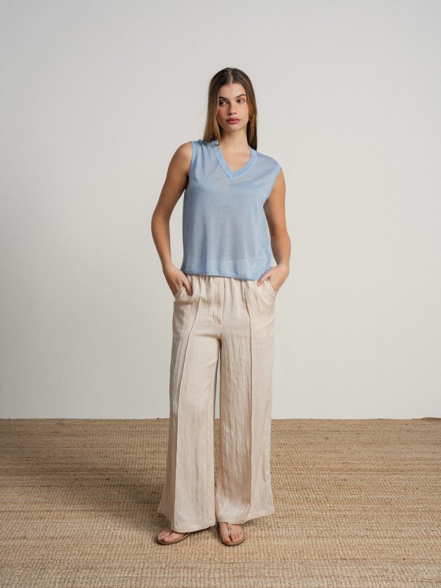 Sleeveless v-neck camisole with sheer details. Sleeveless v-neck camisole with sheer details.