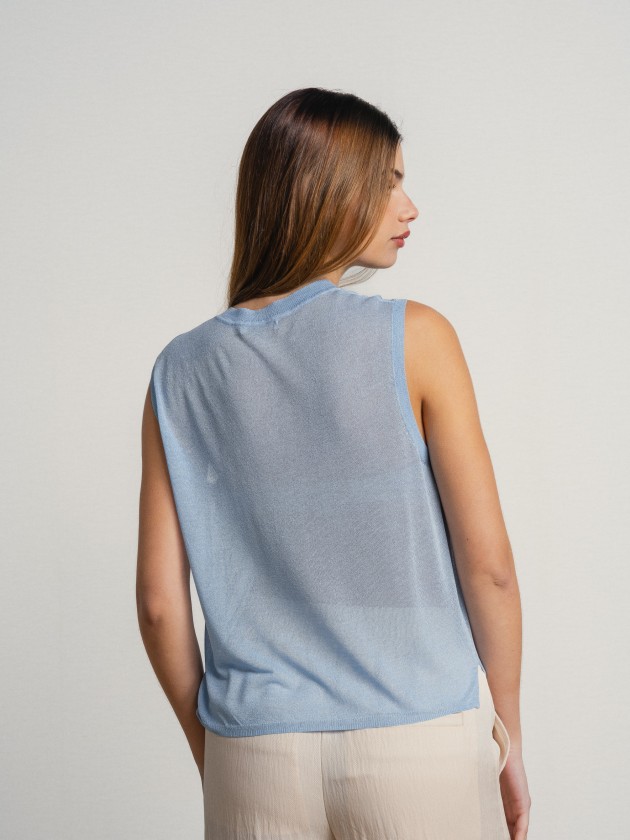 Sleeveless v-neck camisole with sheer details. Sleeveless v-neck camisole with sheer details.