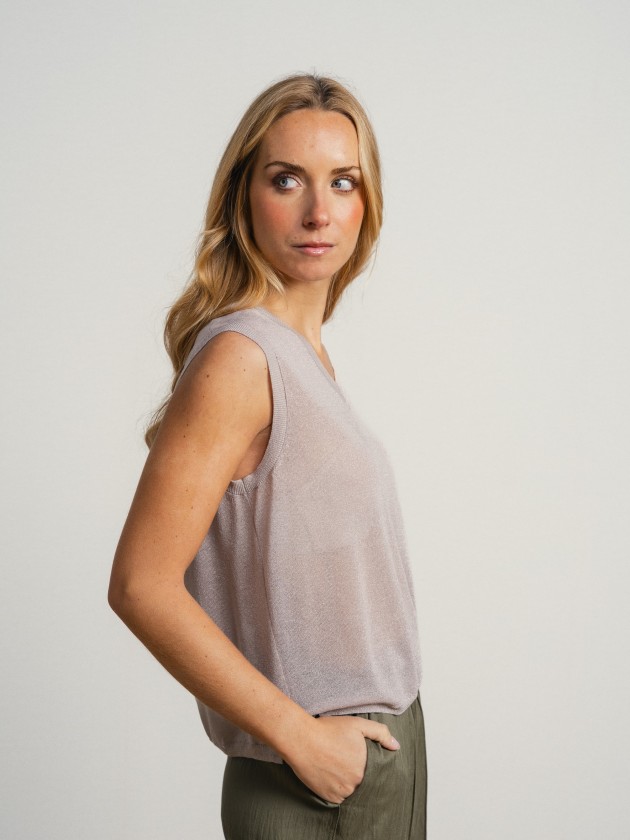 Sleeveless v-neck camisole with sheer details. Sleeveless v-neck camisole with sheer details.