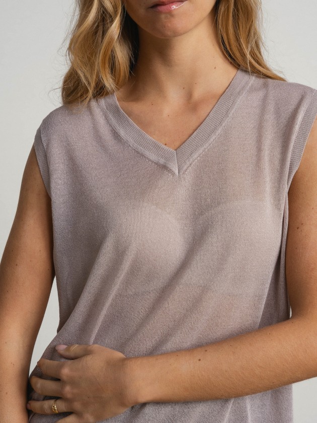 Sleeveless v-neck camisole with sheer details. Sleeveless v-neck camisole with sheer details.