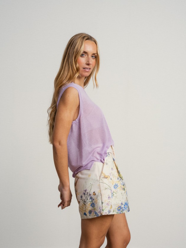 Sleeveless v-neck camisole with sheer details. Sleeveless v-neck camisole with sheer details.