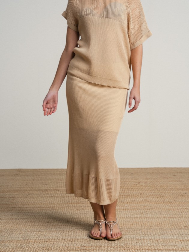 Long skirt in fine knit fabric with sheer details.