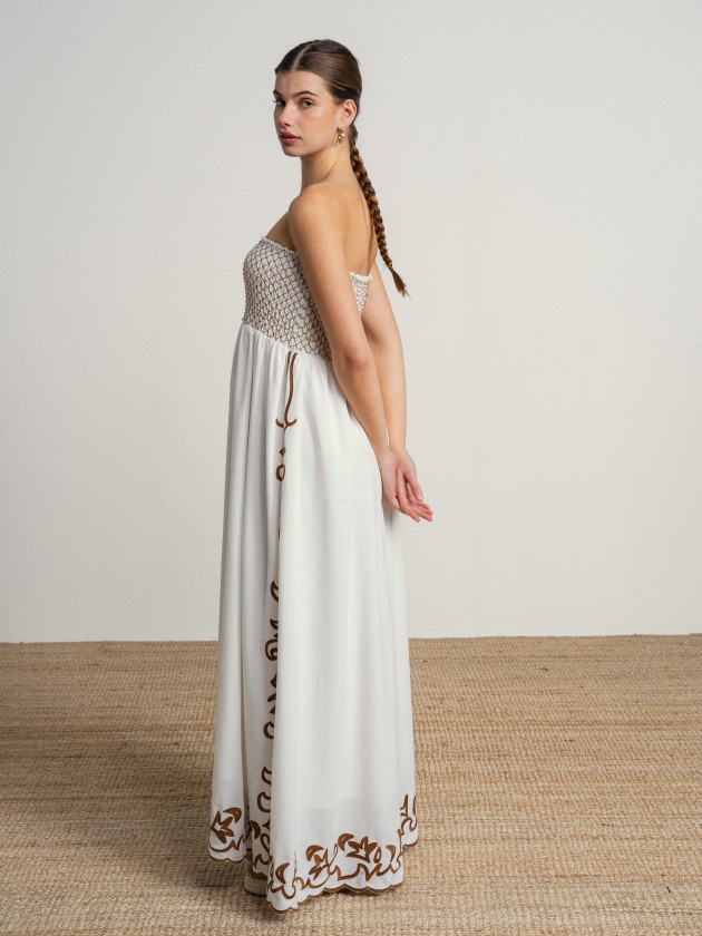 Long strapless dress with embroidery.
