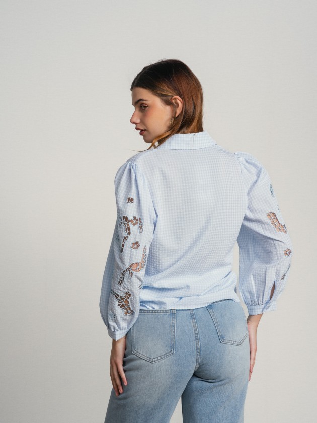 Shirt with embroidery on the sleeves.