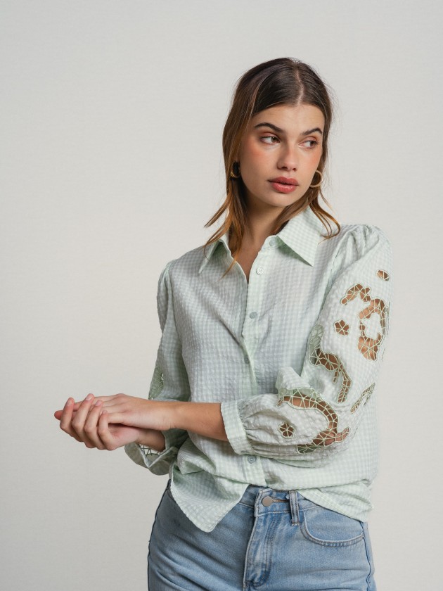 Shirt with embroidery on the sleeves.