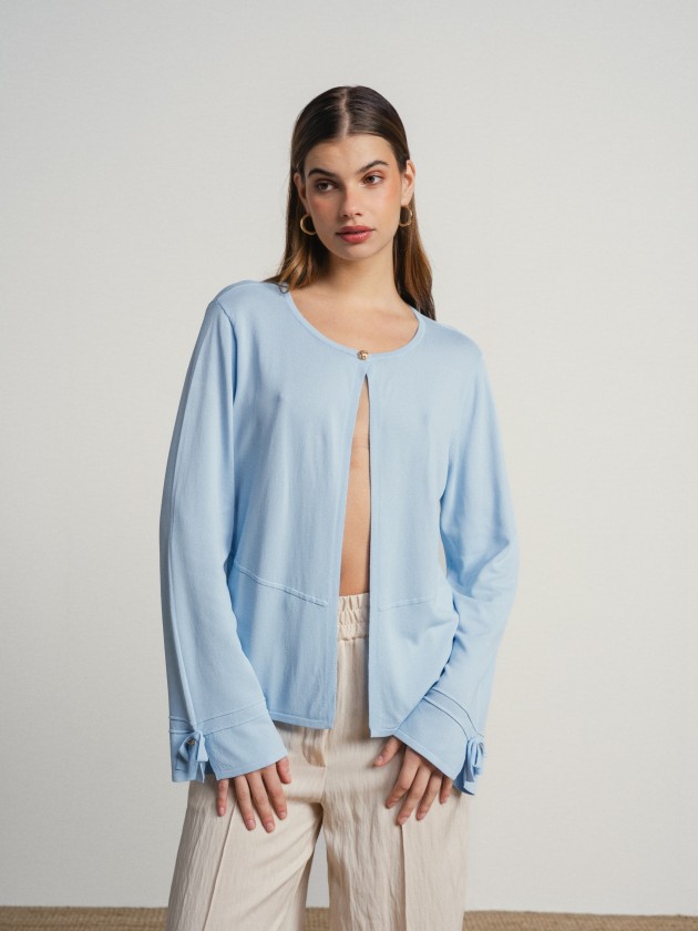 Knitted cardigan with bow on the sleeves Knitted cardigan with bow on the sleeves