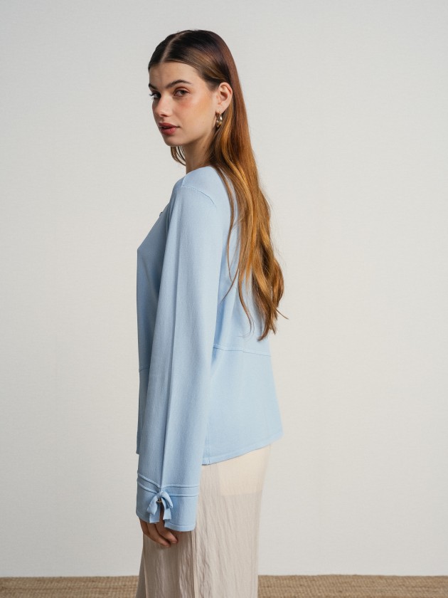 Knitted cardigan with bow on the sleeves Knitted cardigan with bow on the sleeves