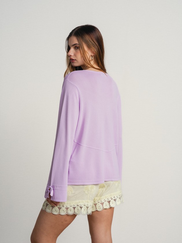 Knitted cardigan with bow on the sleeves Knitted cardigan with bow on the sleeves