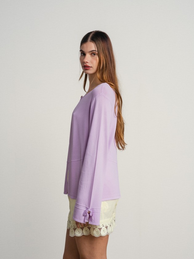 Knitted cardigan with bow on the sleeves Knitted cardigan with bow on the sleeves