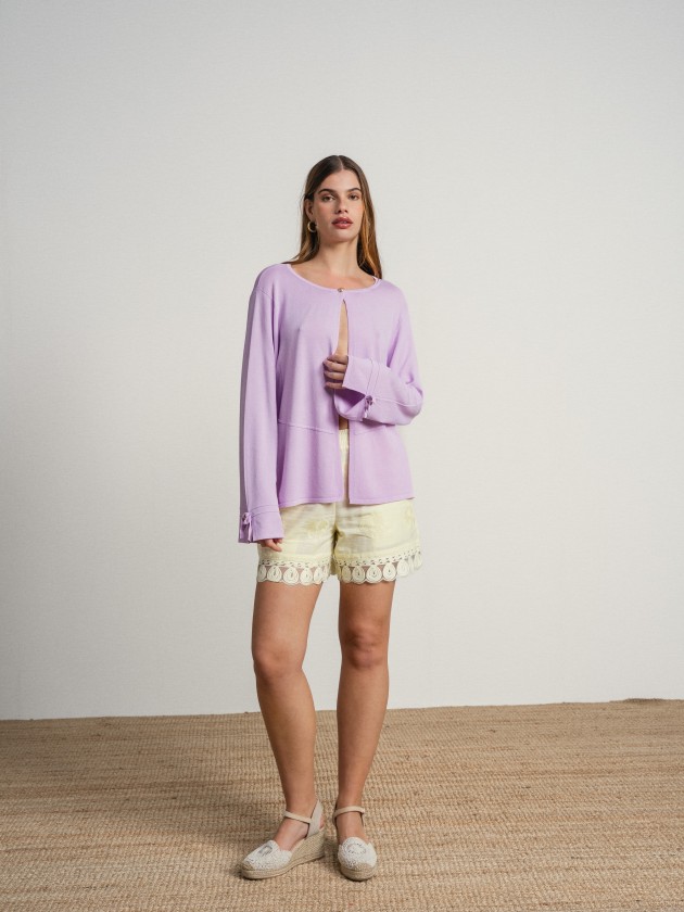 Knitted cardigan with bow on the sleeves Knitted cardigan with bow on the sleeves
